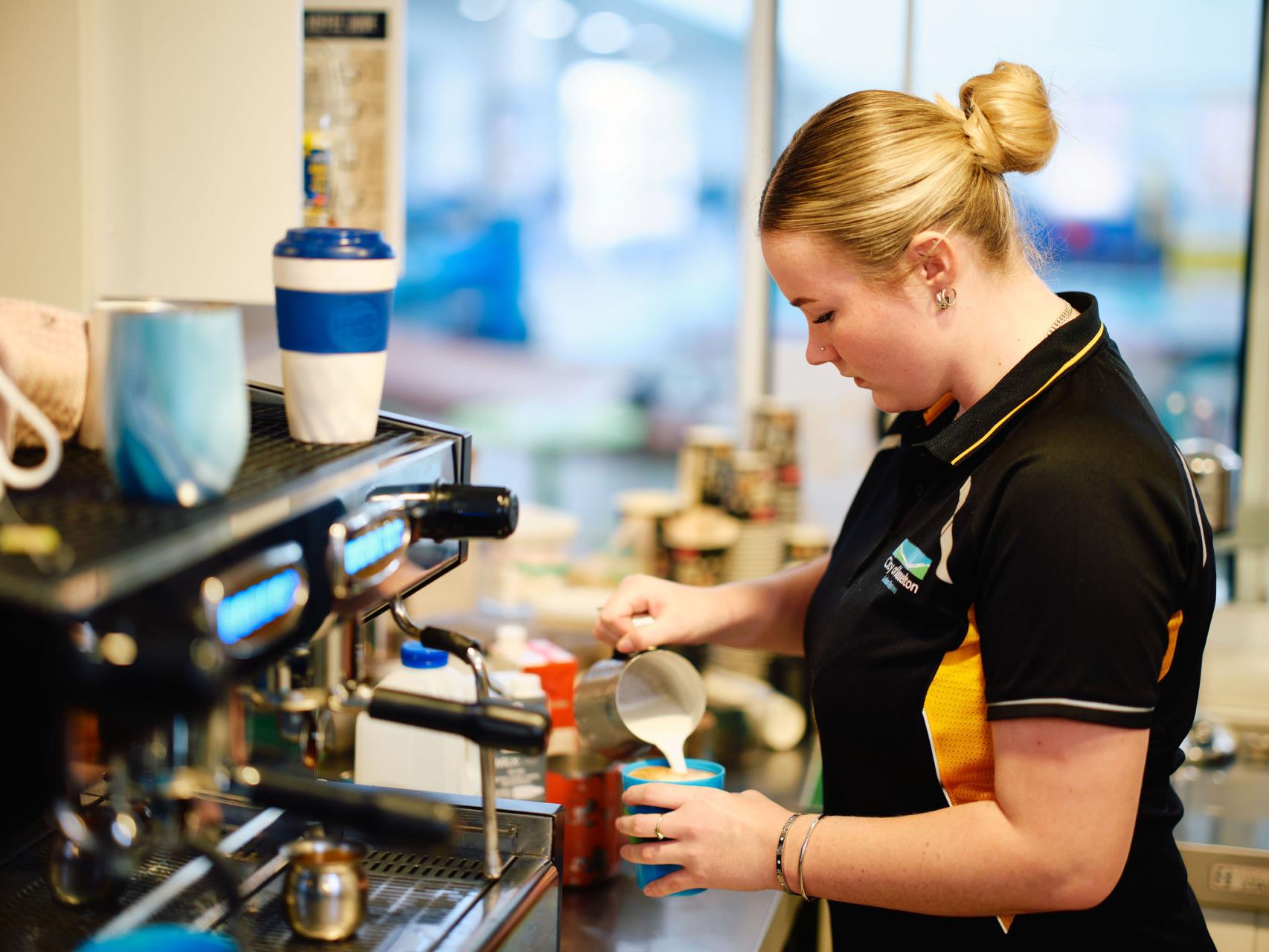 GLC Barista making a coffee in the cafe